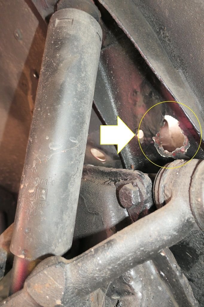 I made this hole after finding 'swelling' on both sides - both sides of my car were affected