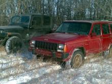 My XJ and my buddies YJ taking a break from playing in the snow just after Xmas. Too damn cold (-30 and wind) to be outside for long and neither one of us would stay out long enough to take pics of the hill climbing we were doing in a gravel pit. I'll get some soon. Showed me you don't want mudders in the winter though. He runs 33&quot; BFG Mud T/As and I run 235/70 Hankook A/Ts. I was out climbing him everywhere we went. He's switching back to his A/Ts for the rest of the winter real soon.