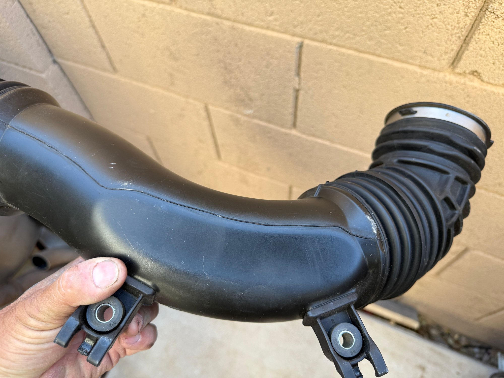  Top view of the air box tube as it sits in your engine.  The throttle body attaches at the right end of this tube, air filter off camera to the left