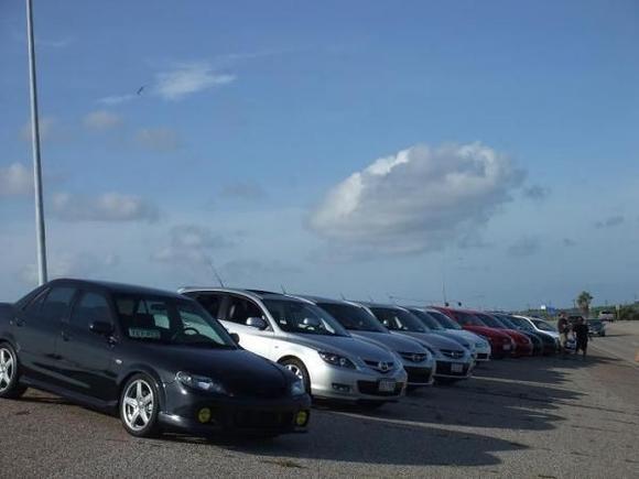 these are 14 mazdas of various makes and models parked at a place called cherry hill for a photo op. the cops showed up at a certain point, but we verified that we weren't hondas and he let us be.