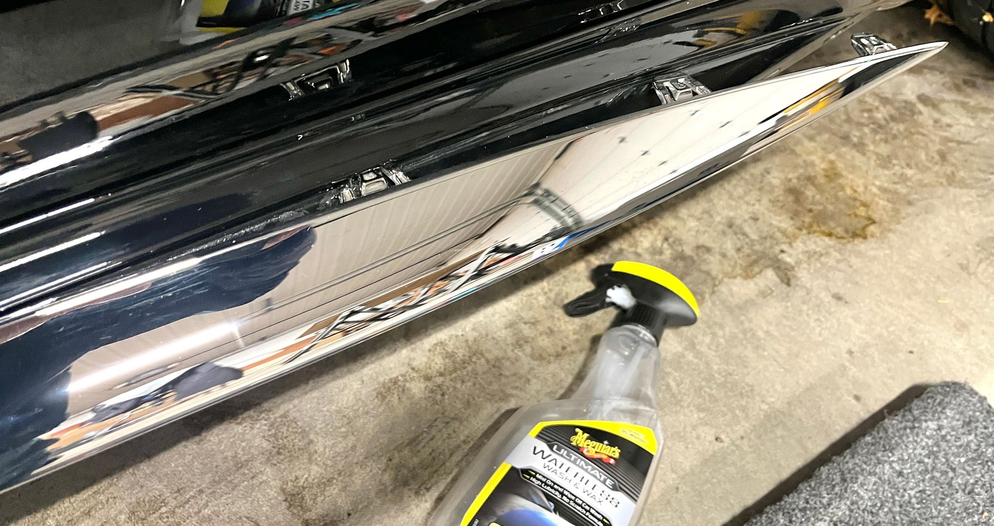 Rear side skirt trim partially removed.