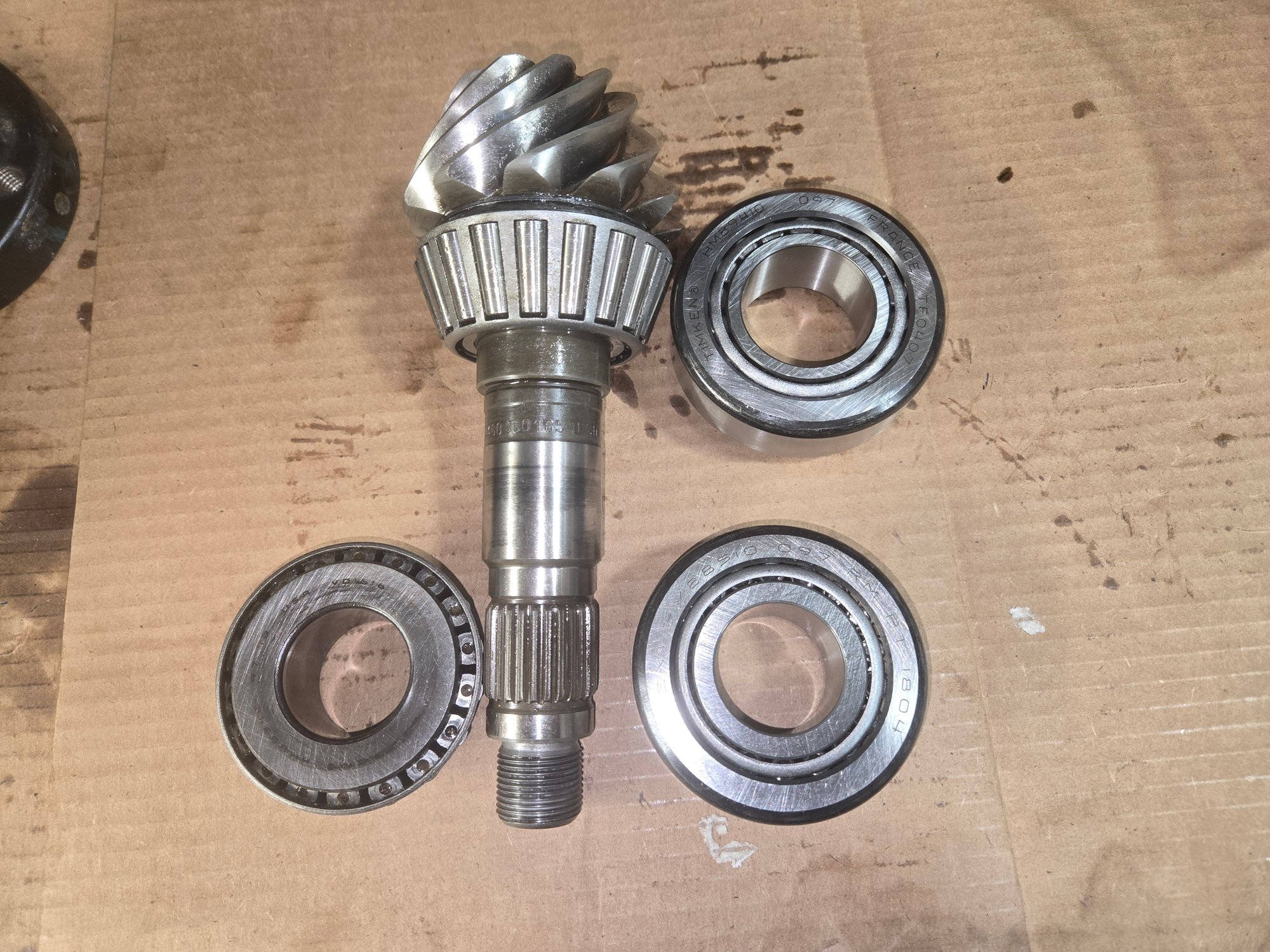 Pinion shaft removed. The 2 new bearings are on the right. The crush washer that sits on the shaft and between the 2 bearing, is not in this image.