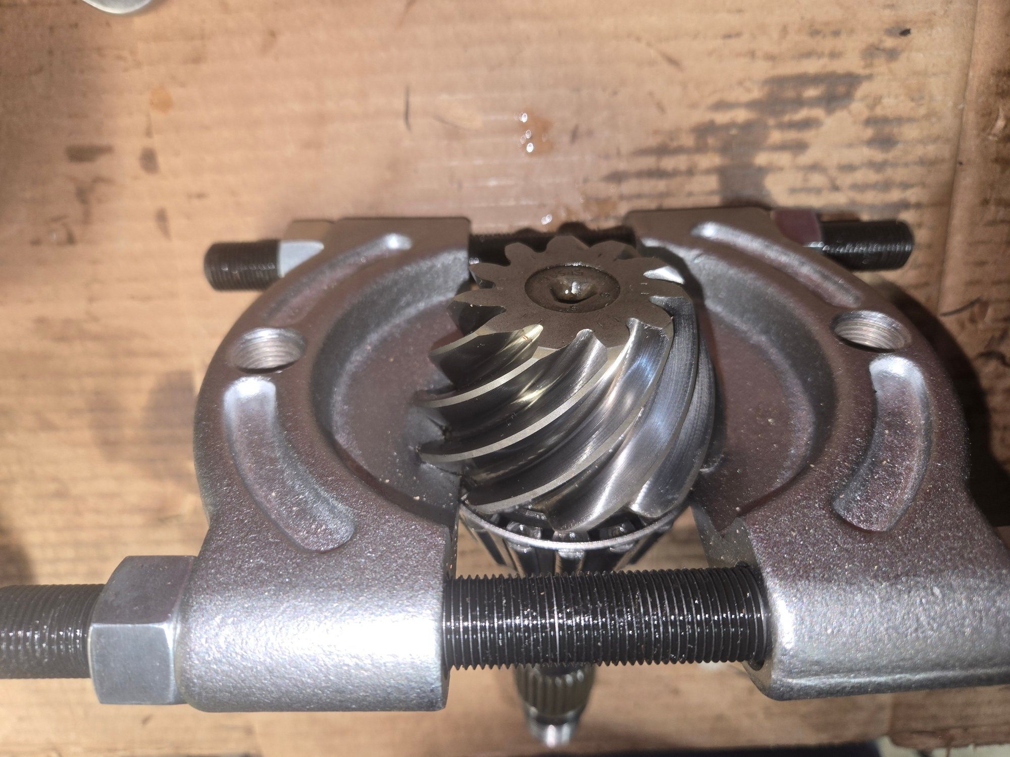 Preparing to press the bearing off from the pinion shaft.