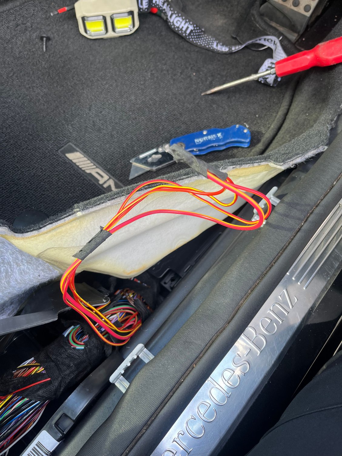 I followed this wire from fuse box into driver side (right hand drive) footwell it�s goes into a a bunch of wires that splits back into the car and then I have up.   103 fuse is still blowing.  Somebody must have resolved this issue.  Pls help !