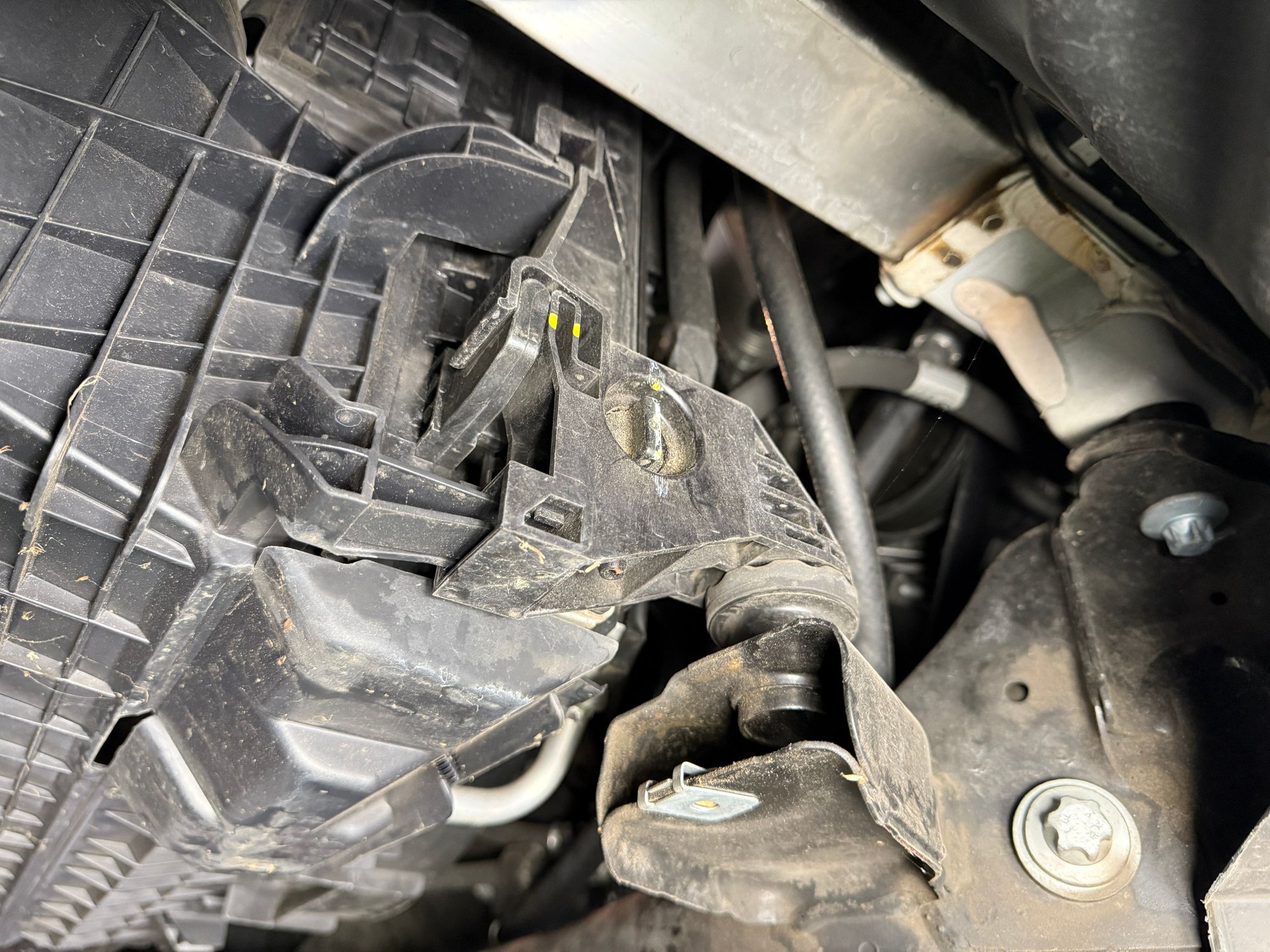 Location of 2012 GLK350 coolant drain petcock.