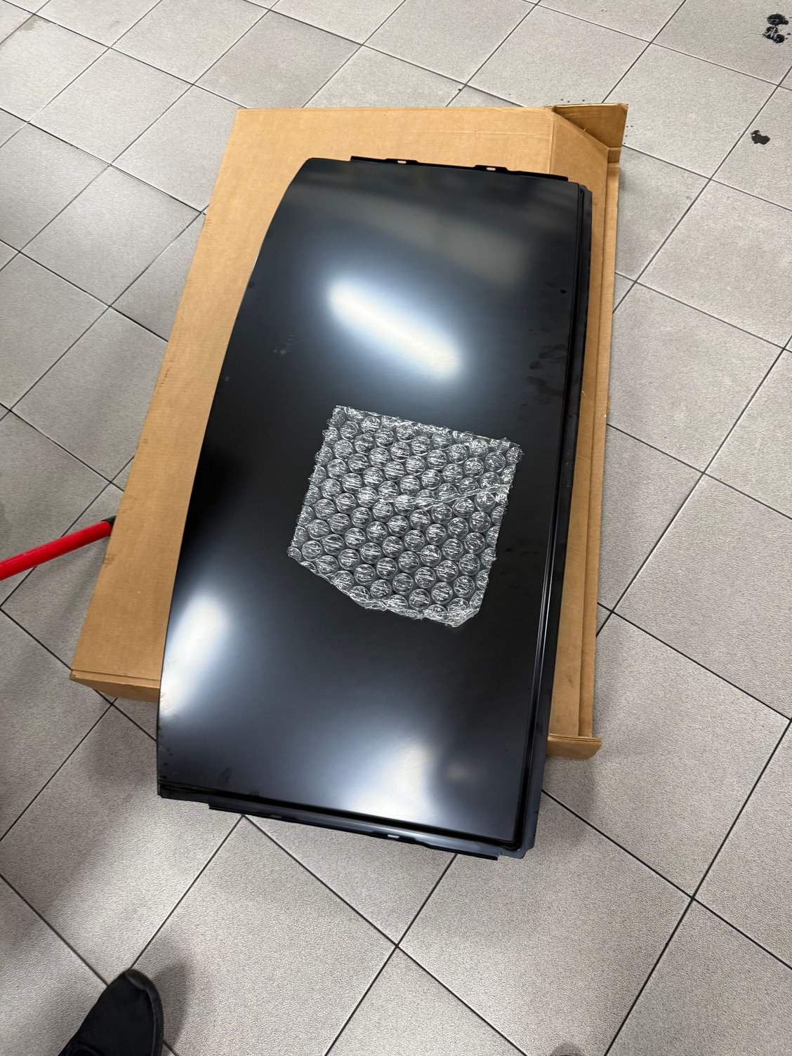 The new rear roof piece to be assembled.