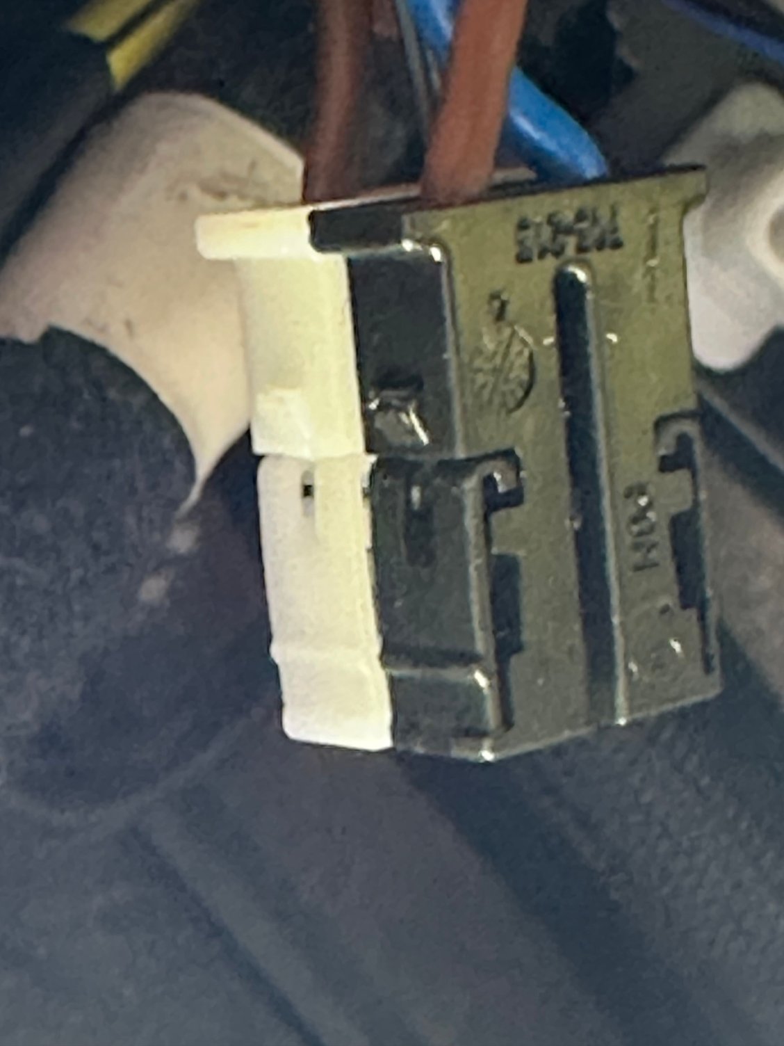 This is the plug you will swear at. I ended up using a pick next to the ridge to pull it out 