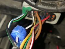 Tap the gray white wire at the headlight connector