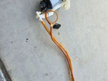 This is the fuel pump sending with the sending unit completely removed. I wanted to make sure that I laid it out so that when I ordered the new part it would look exactly like this. Please note that this unit does not have any wires with it just the two hoses