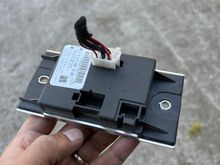 The factory rear control module for sending power to the rear seat heating elements. 