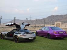 This is a cool Saudi duo. Chrome Mercedes Benz SLS AMG and Purple Mercedes Benz S-Class.