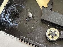 I used a screw, being careful not to go deep into the foam or leather just on the other side.