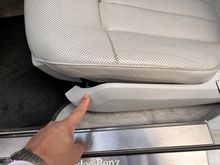 For some unknown reason my seat trim was detached from the frame. Have no idea how this happened but it might be a small crack that formed on the trim tab that slides over the seat frame tab. I am pointing to the trim piece. That small gap between the trim and seat bottom should not be there 