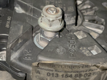 Old Bosch alternator and notice the TWO grooves or slots to the alternator bolt. 