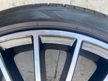 Minimal curb rash fixed in a shop.