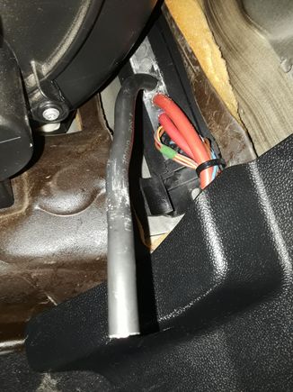 And came out through the footwell side of the grommet block...