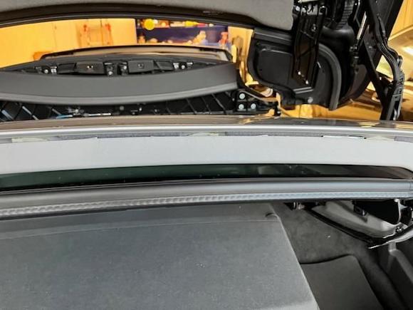 After applying strips on both sides, remove wedges, lift headliner up and push forward to attach Male to Female strips. It not necessary for 100% attachment, just enough to adhere the sides together.
Clean up pencil marks, test Open and Close roof, test drive and enjoy your now Quiet R230 Roadster again!
