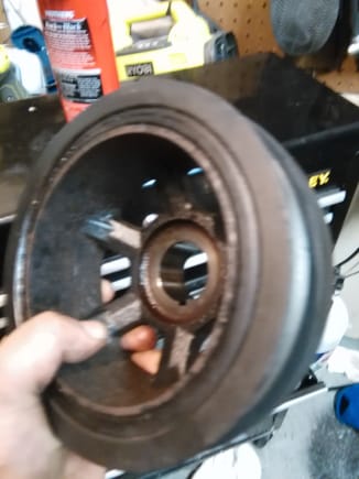 Mercedes pulley off of vehicle showing signs of rubber failing