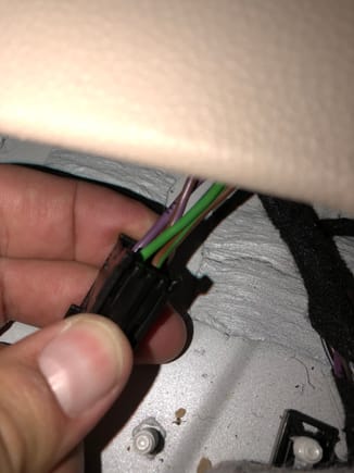 Unplugged the sub connector.  It's in the front.  To get to it, gently remove the rubber bottom from the front cupholder to reveal a torx screw.  Remove the screw.  Pull up from under the outside front corners of the seat on each side and you'll hear a "pop" and feel them release.