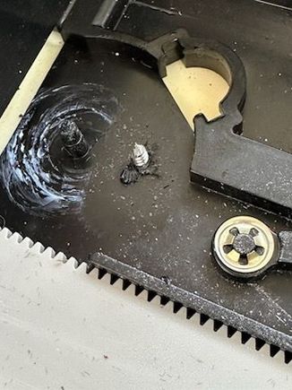 I used a screw, being careful not to go deep into the foam or leather just on the other side.