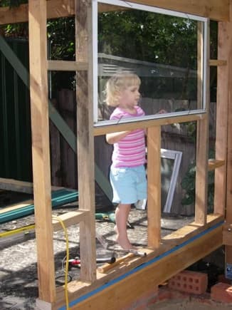 my precious daughter looking out the window.
got some windows from a demolition site.