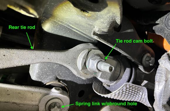 Left tie rod cam bolt viewed from behind rear axle.
