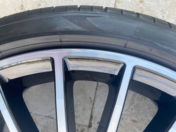 Minimal curb rash fixed in a shop.
