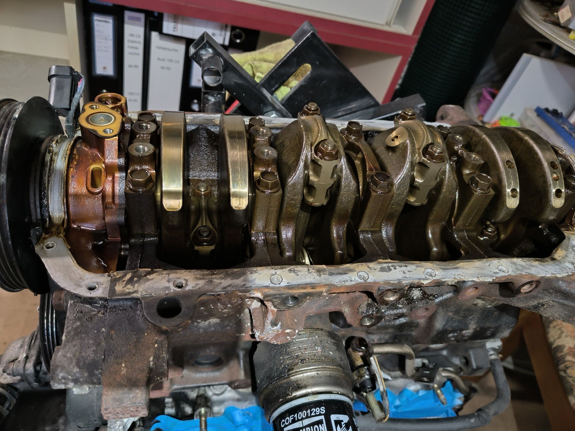 Put it on the engine stand to inspect one or two main cap bearings, looked good. Also cleaned up the oil pan, main bearing support plate and all the sealing surfaces. Installed my skidnation oil pan baffles and put it back together for transport to my mechanic.