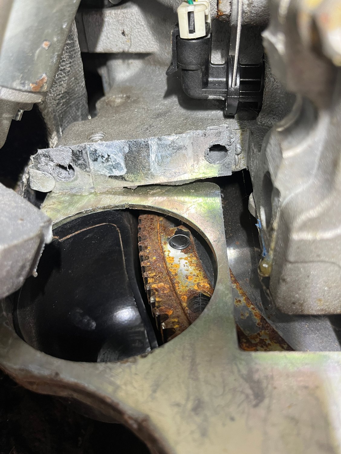 The flywheel has to be accessed to install a locking tool, so I can install the vibration damper/crankshaft pulley. 