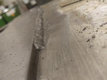 Welding plates to the body with a harbor freight flux core welder.