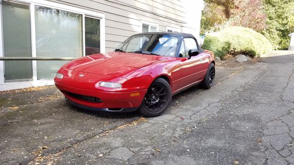 How it sits now. Suffered a hit and run so used it as an excuse to repaint. No more stripe, added the black windshield frame and mirrors and r-pkg front lip.