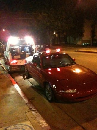One of the sad days of lately, 91 being towed off cuz I ran above a curb that wasn't visible at the moment. Axle steering were shot. Took my life savings, spent 6k and got a 00NB =] THE REST IS STILL BEING WRITTEN.