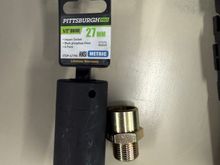 The sandwich plate is held on with a large 27mm/1 1/16” nut.  Required a trip to Harbor Freight as I could not get an adjustable wrench in there to snug it down. 