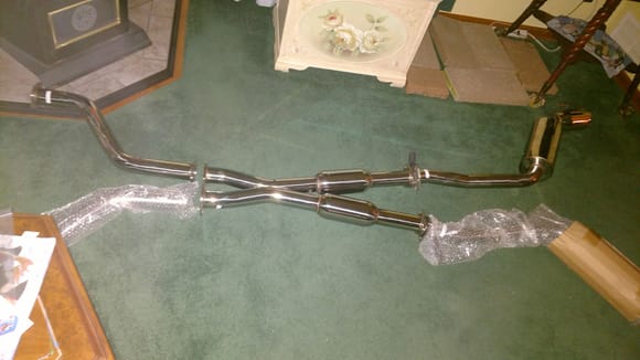 Yup. That's a sedan's exhaust.  Mine to be specific. 5th set up I am trying on a na vq engine but only the 3rd I put on one of my vhr's, and the others were 3.5's. this fits my 09 G37xS so it should fit any 3.7L 4dr. Fell in love with this set up as I ALWAYS hated my various sedans y-pipes.  😉Has a graduated width all the way through. Dual OBX canisters too. Looks great. Good welds. tips of the actual exhaust are a little big@ 4.5inches and then they added on 6" tips, Overkill imo. OBX branded.