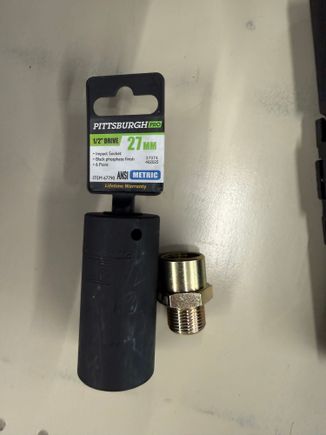 The sandwich plate is held on with a large 27mm/1 1/16” nut.  Required a trip to Harbor Freight as I could not get an adjustable wrench in there to snug it down. 