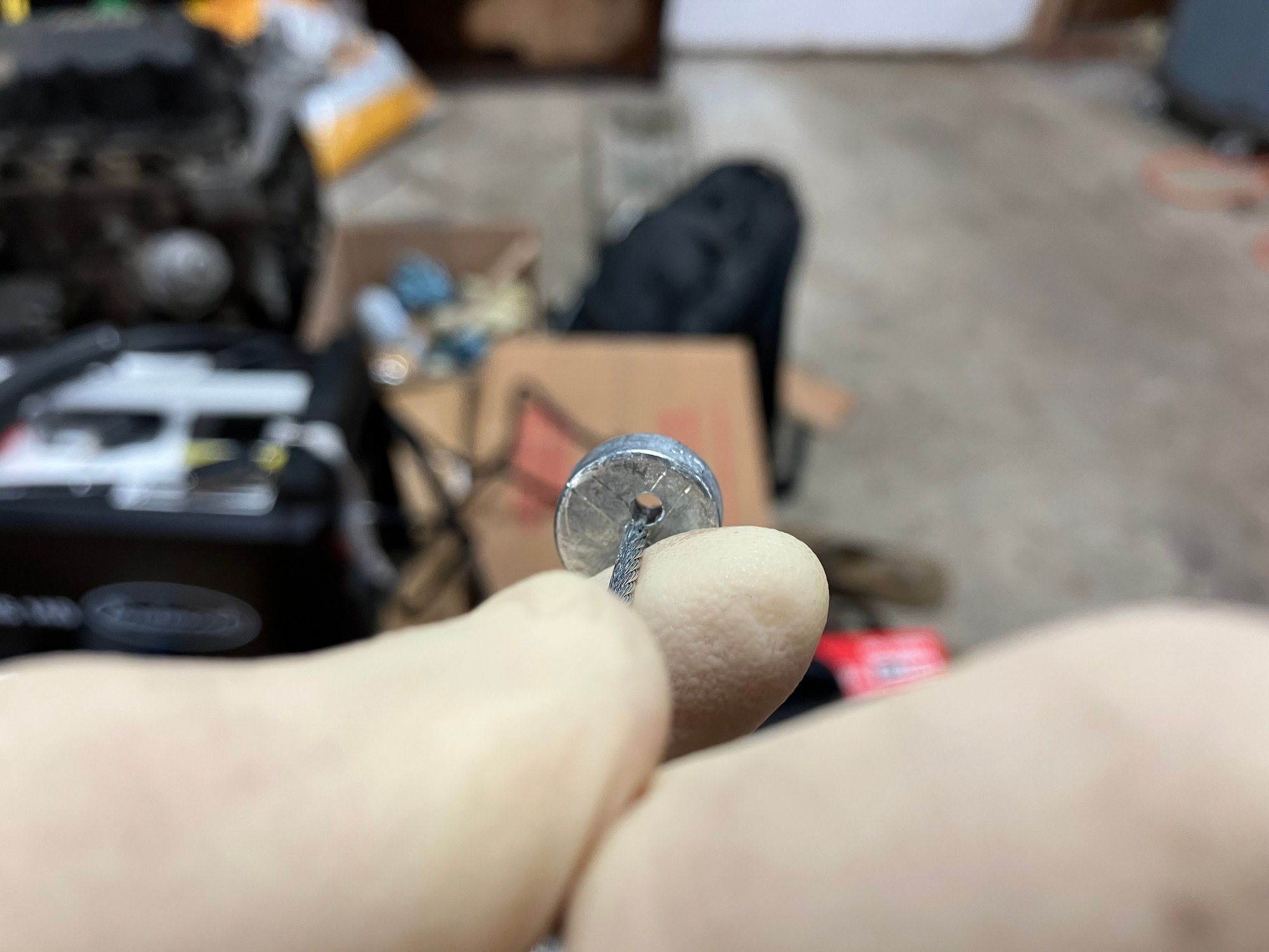 On the end of the throttle cable will be this metal puck. You�ll want to drill a small hole on one side