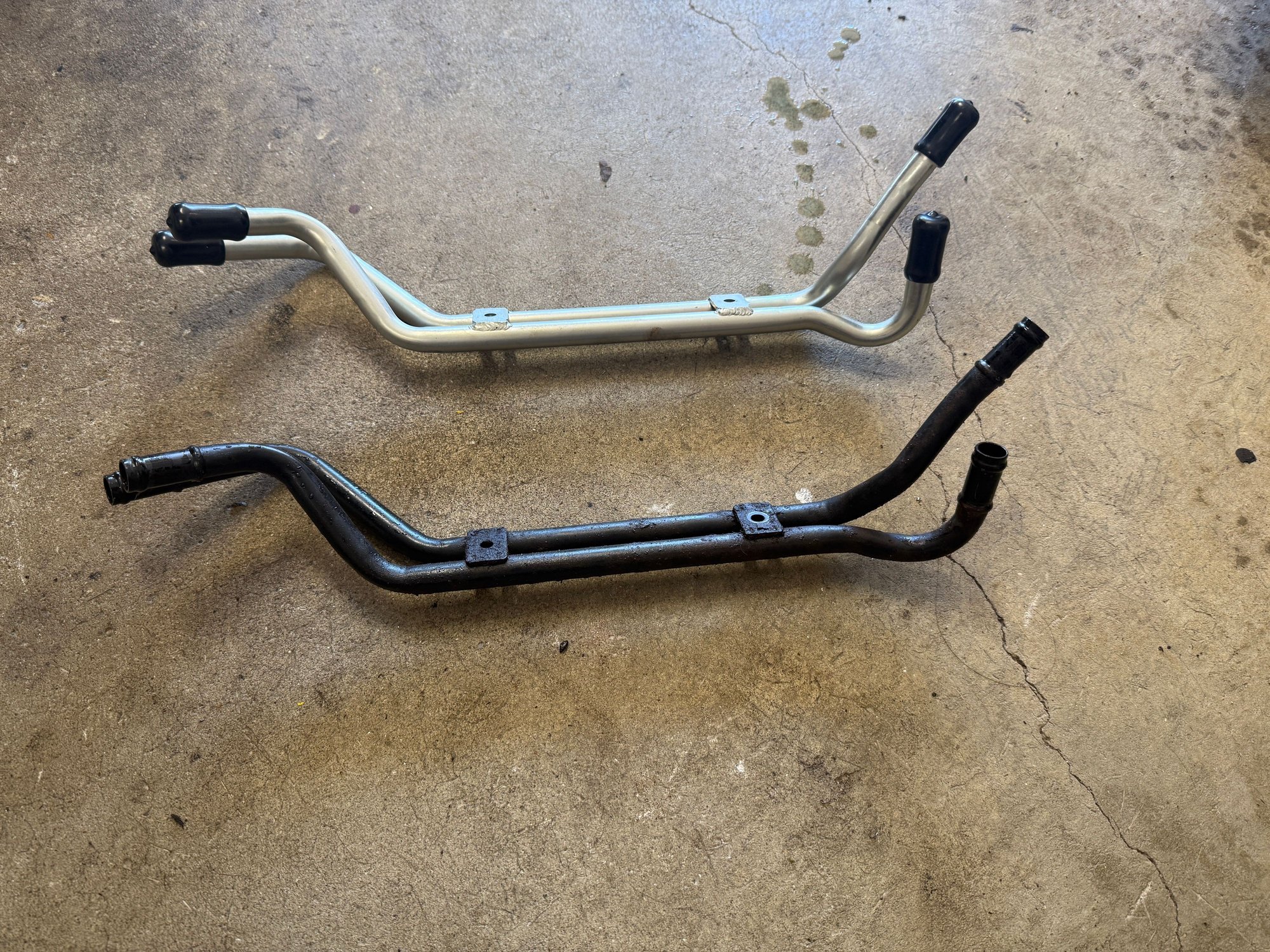 New lower coolant pipes.  Old one was probably done, replaced “while I was in there”
