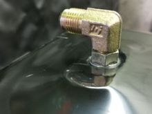 Found that with nothing more than re tapping the hole this fitting worked just fine. Put plenty of rtv on the threads, under the washer, and on the inside. 