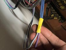 Both wires joined with a butt connecter, with two wires on the other side