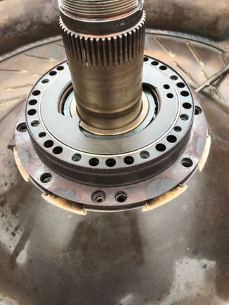 Carefully install bearing retainer
Pinch plate assembly
Take note on oil feed and return oil
Holes match up 
Gently tighten the two flathead
Screws