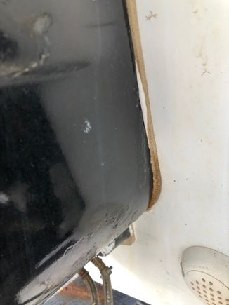 A closer view. Looks to me like this sealant was applied at the same time as the gasket. Maybe they reused the existing gasket and added the sealant as a secondary protectant? 