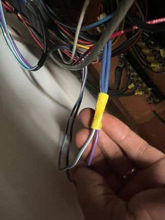 Both wires joined with a butt connecter, with two wires on the other side
