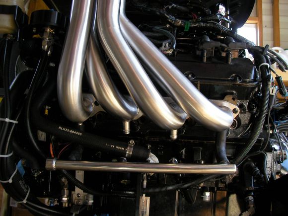 but the hoses for the water tube will not not work, on the port side they let the tube lay on the engine mount. on both tubes, the hose fittings don't line up w/ the hose fittings on the exhaust.
the stock hose from the engine isn't anywhere near the end of the tube which is fine because the alternator is blocking it anyway. this tube will have to be plumbed in backwards.