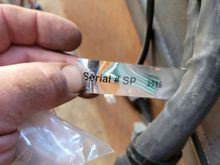 Here is the serial number tag off the harness. Is "SP" a clue?