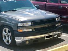 My neighbors truck cowl hood with the HD grille and tahoe z71 valance/fogs