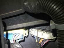 The connectornon the right is the one in question.... I have not disconnected mine yet, but i want to find out what runs through it before i do.... And need find a harness that is compatible with it...