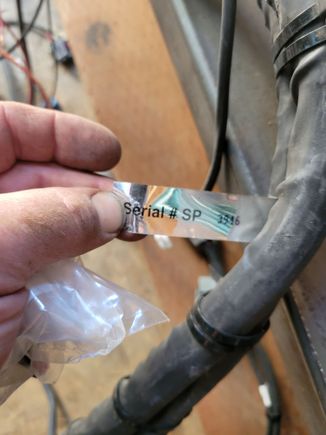 Here is the serial number tag off the harness. Is "SP" a clue?