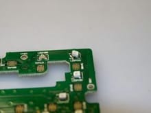 Figure 6 - Removing the OEM LED one side at a time.  Low heat what the flow of the solder and do not pull up too hard or you can damage the PCB Pad the component is mounted to.