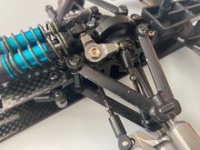 These arms I purchased here on rctech. They are a cast metal and have delrin inserts. Tamiya aluminum locker arms. 