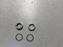 I believe I solved the issue.  You need to shim the bearing, not the arm!
